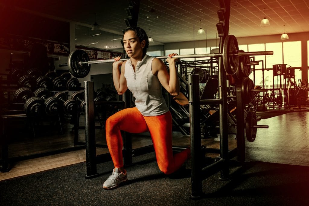 woman doing split squats