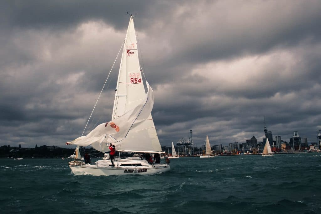 a sailboat struggling in a storm