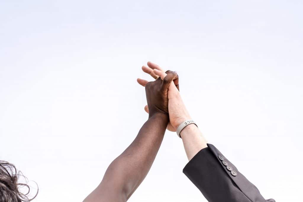 Two people celbrating with a high-five