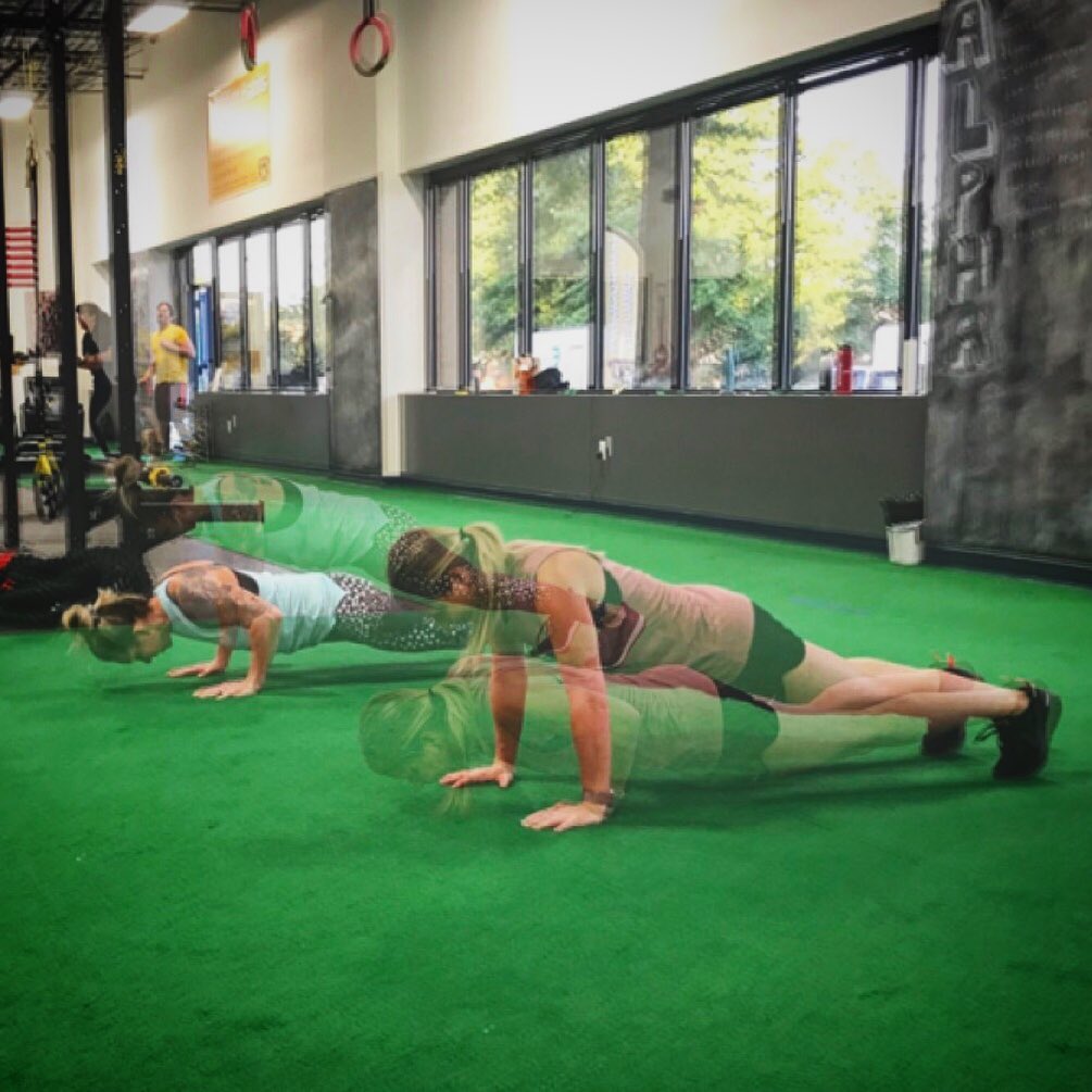 Jess and Danielle performing push-ups at BSP NOVA in Sterling, Virginia