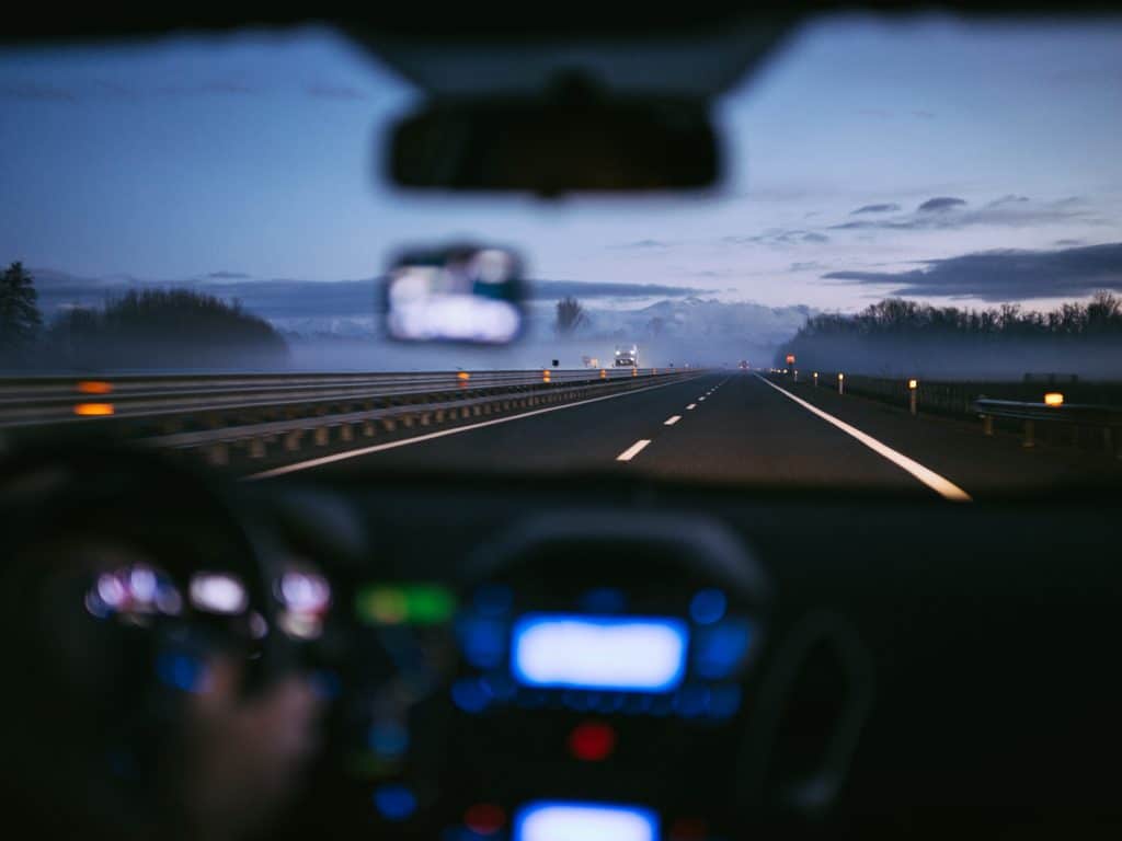 a picture of someone driving a car