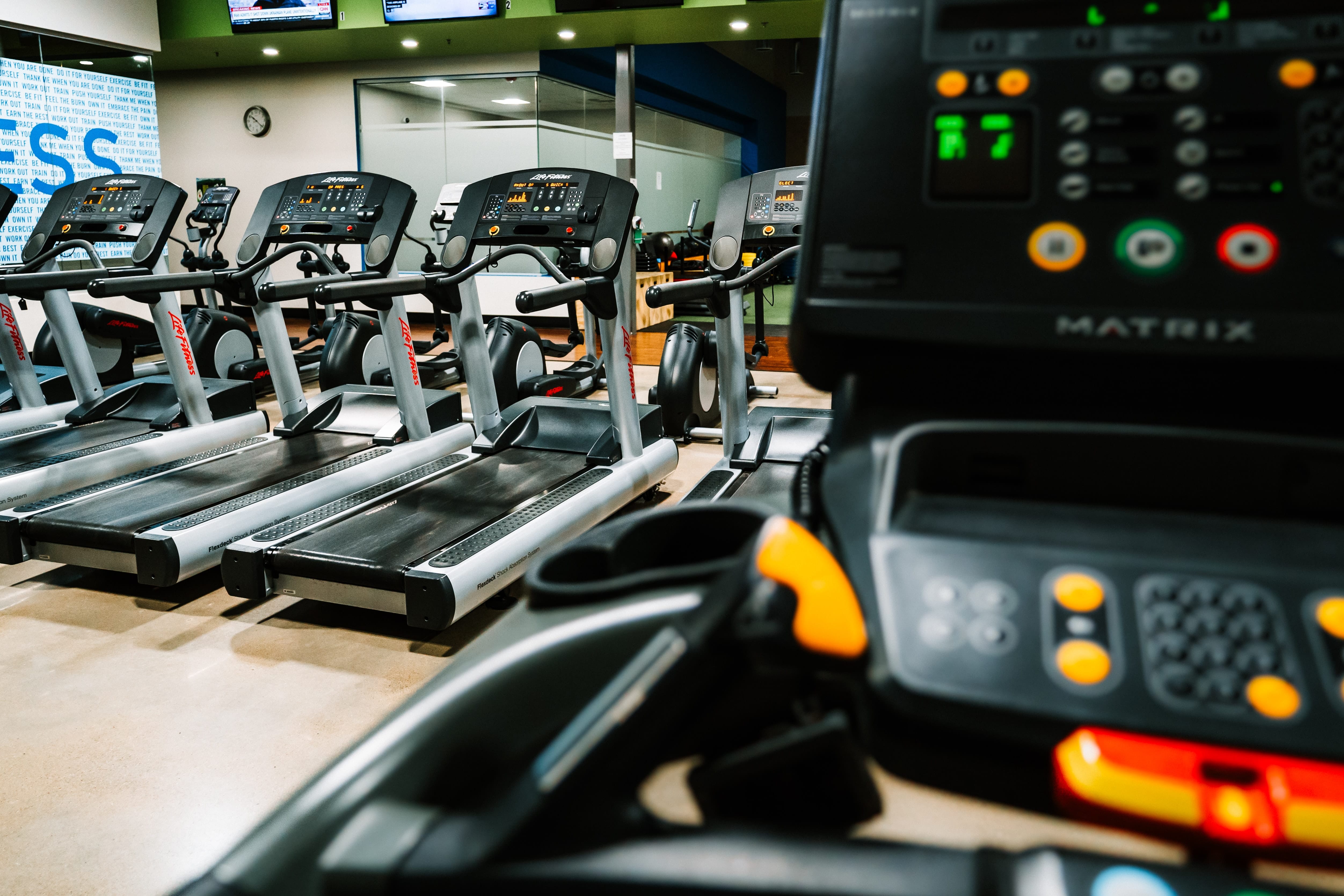 a row of cardio machines