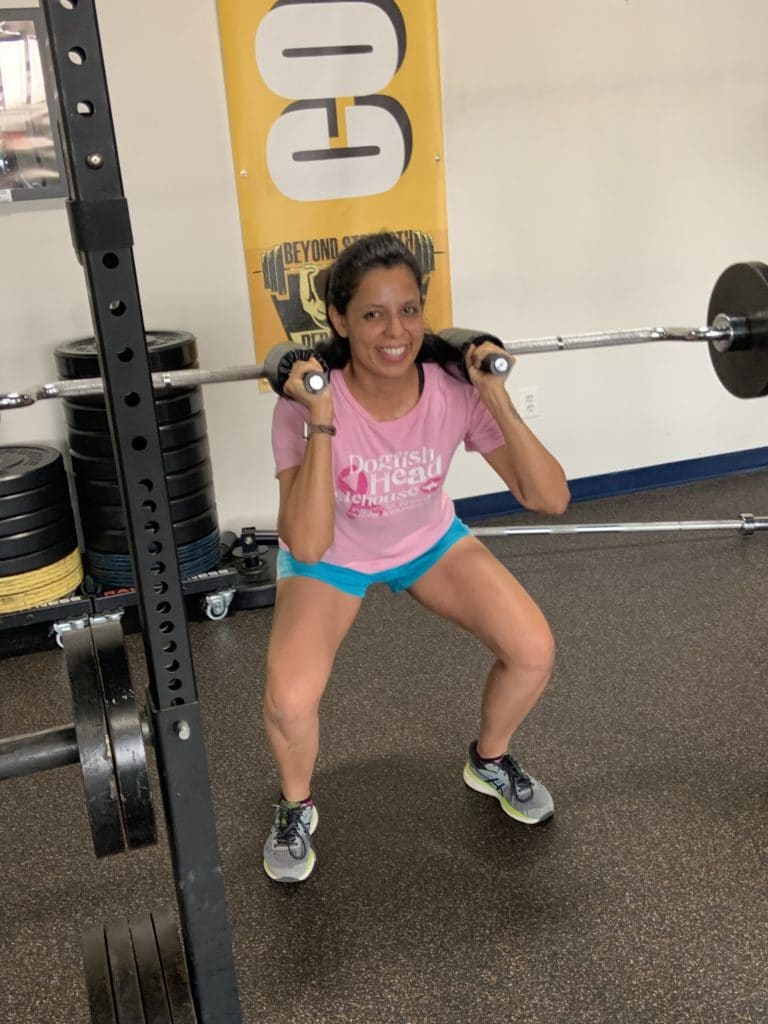 Jasmin squatting at Beyond Strength in Sterling, Virginia