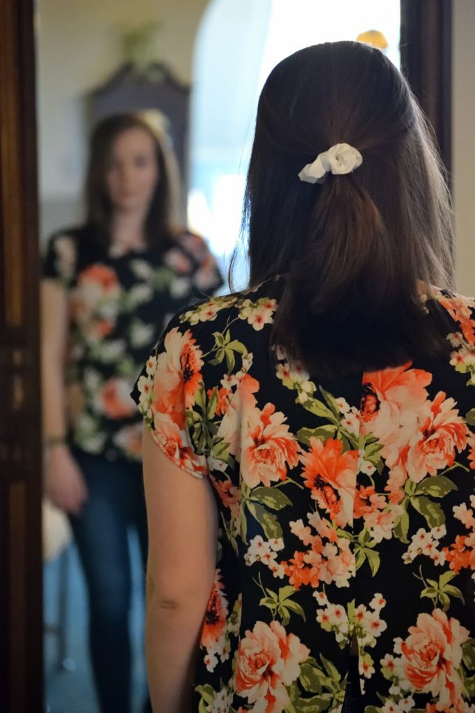 A woman looking in the mirror
