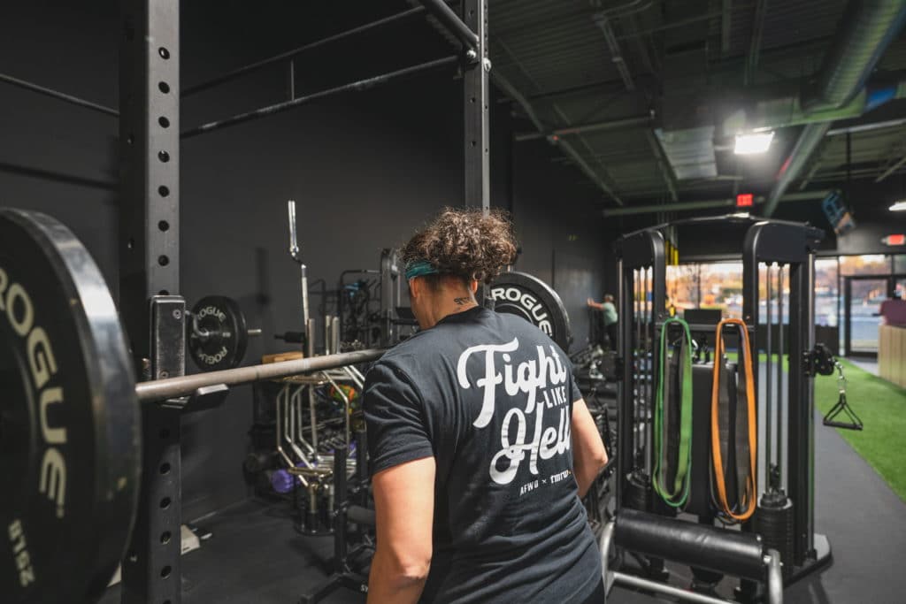 Tiff setting up for squats at Beyond Strength in Sterling, Virginia