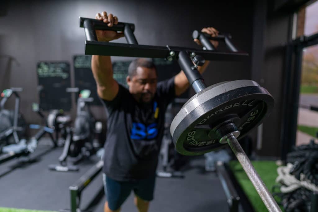 Fritz doing a viking press during a strength block at Beyond Strength in Sterling, VA