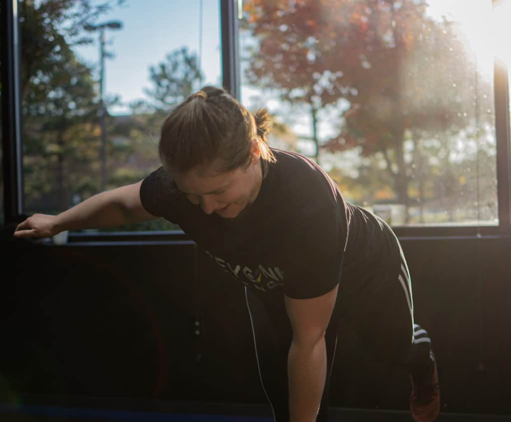 Lauren doing a single leg RDL during her training program at Beyond Strength in Sterling, Virginia