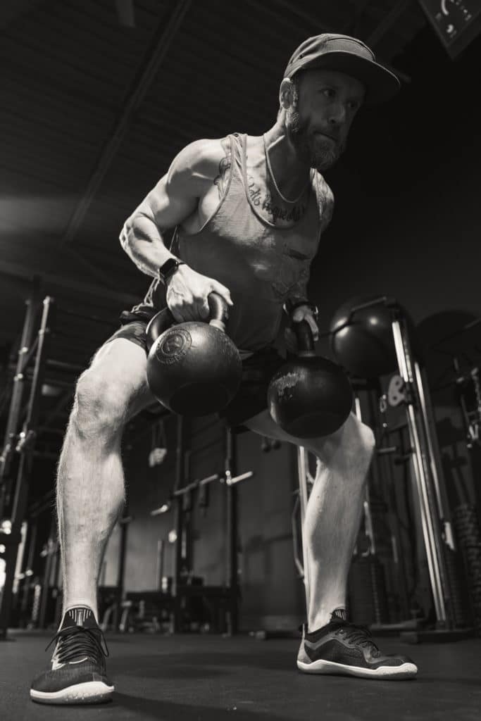 Chris, founder of Beyond Strength, doing bent over rows during a muscle growth phase of training at Beyond Strength gym in Sterling, VA