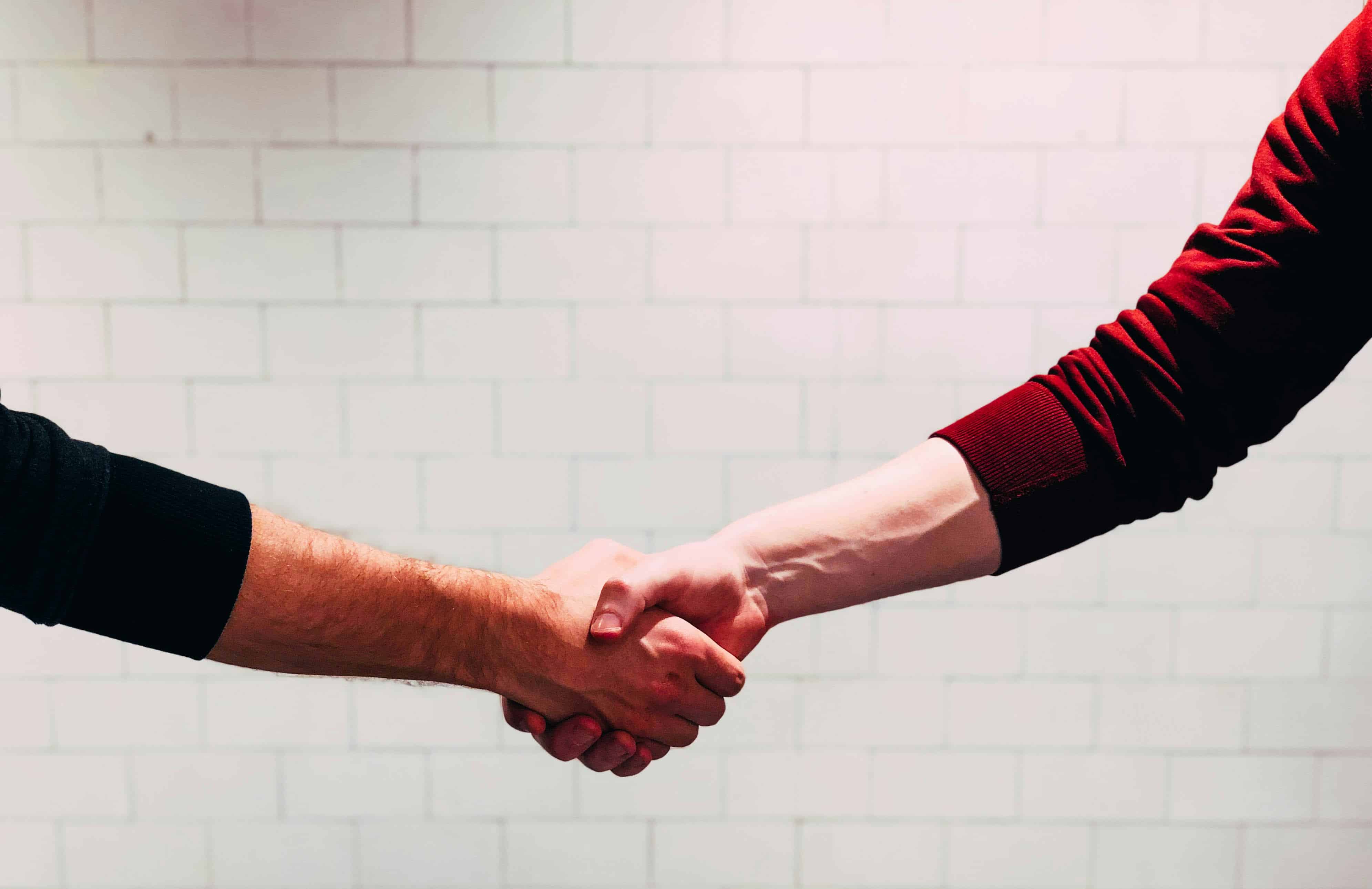 two people shaking hands during a free consultation at Beyond Strength in Sterling, VA