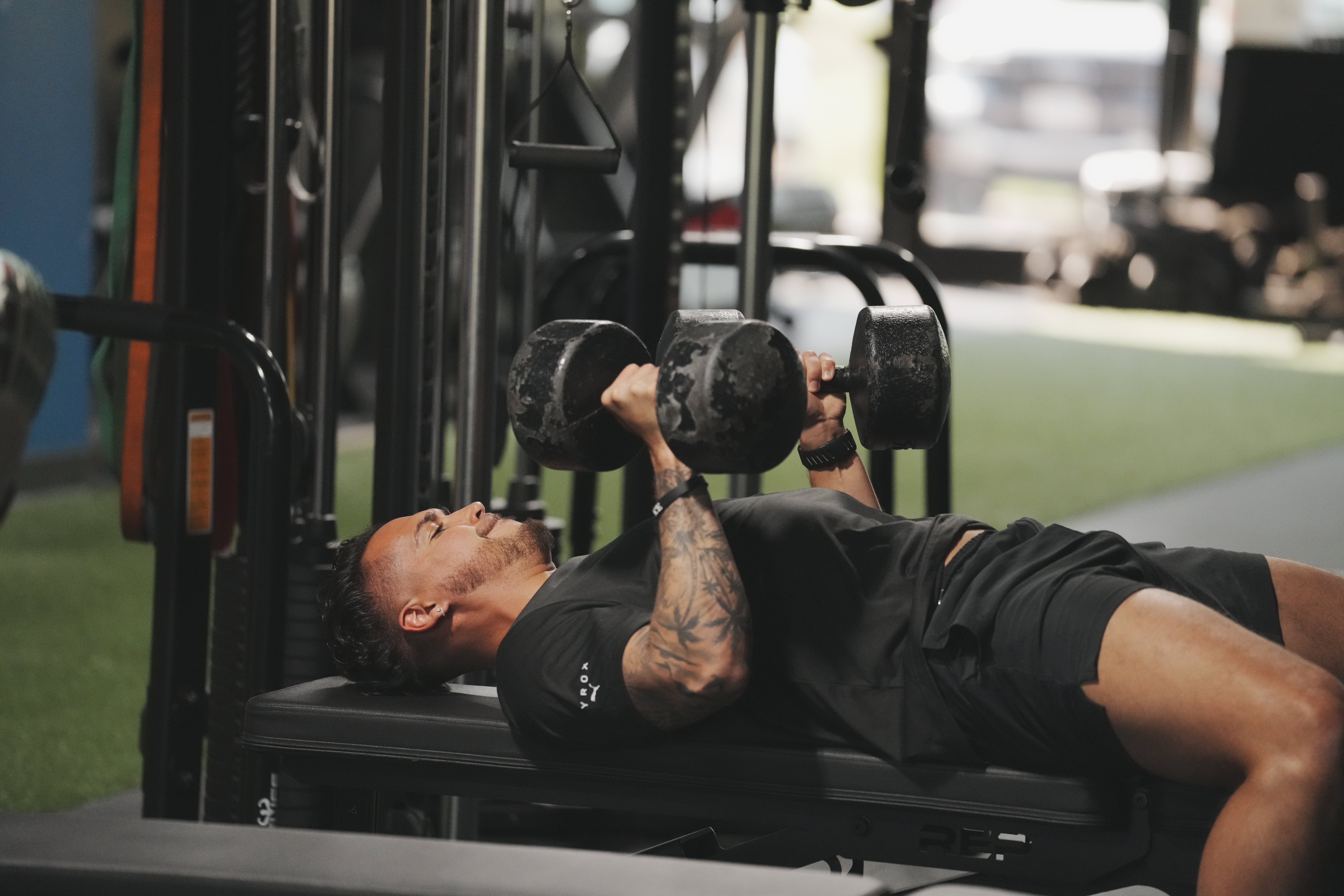 Isaiah Edwards dumbbell bench pressing at Beyond Strength in Sterling, Virginia